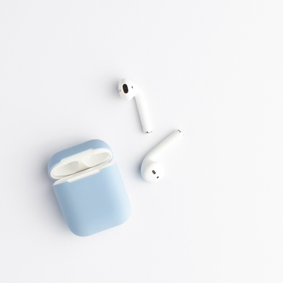 Airpods in dusty blue case
